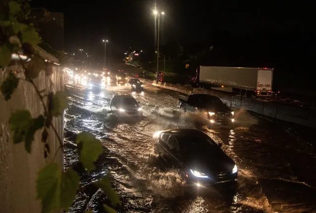 On July 24, 2021, a severe thunderstorm rolled through the city of Detroit bringing a downpour that flooded I-94 and many other roadways in and around the city as well as resident's homes. Once an uncommon occurrence, this is now the third flood in Detroit in a month and a half. (Photo by Adam J. Dewey/NurPhoto/Rex Features/Shutterstock)