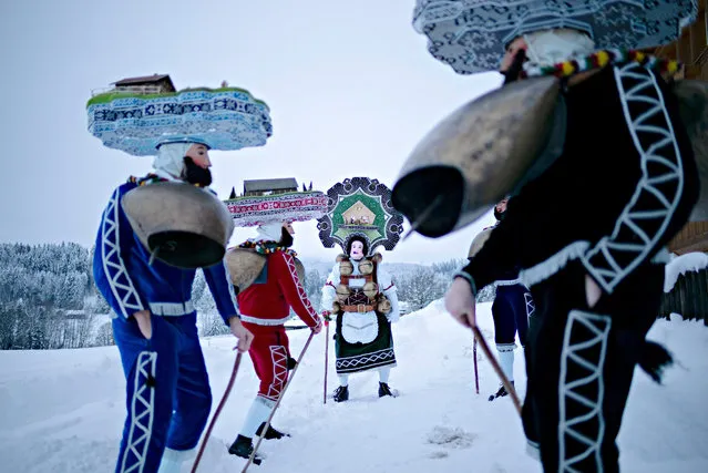 People participate in a procession to offer their best wishes for the New Year at an Alpine village in the canton of Appenzell Ausserrhoden, Switzerland, on January 12, 2019. Silvesterchlausen is commemorated twice, once on Dec. 31 according to the Gregorian calendar and again on Jan. 13 according to the Julian calendar (when the date falls on a Sunday, “Silvesterchlausen” will take place on the preceding Saturday), with special celebration in a few towns in the canton of Appenzell Ausserrhoden with a long-time tradition. (Photo by Xinhua News Agency/Rex Features/Shutterstock)