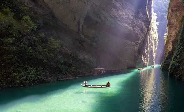 Tourists take a boat ride at the Pingshan Grand Canyon scenic spot on October 16, 2023 in Hefeng County, Enshi Tujia and Miao Autonomous Prefecture, Hubei Province of China. (Photo by Ruan Wenjun/VCG via Getty Images)