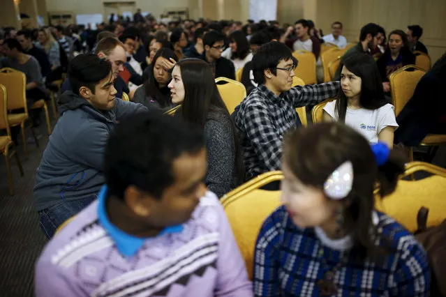 Couples talk during an orientation for an upcoming mass wedding ceremony of the Unification Church at a resort in Yangpyeong, South Korea, February 19, 2016. (Photo by Kim Hong-Ji/Reuters)