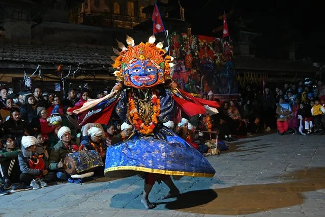 A traditional masked dancer performs during “Pachali Bhairav” dance festival in Kathmandu on December 15, 2023. (Photo by Prakash Mathema/AFP Phoot)