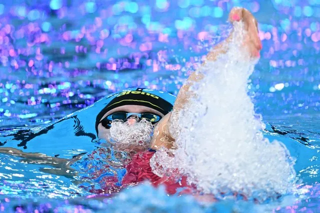 Netherlands' Maaike De Waard competes in a heat of the women's 100m backstroke swimming event during the 2024 World Aquatics Championships at Aspire Dome in Doha on February 12, 2024. (Photo by Sebastien Bozon/AFP Photo)
