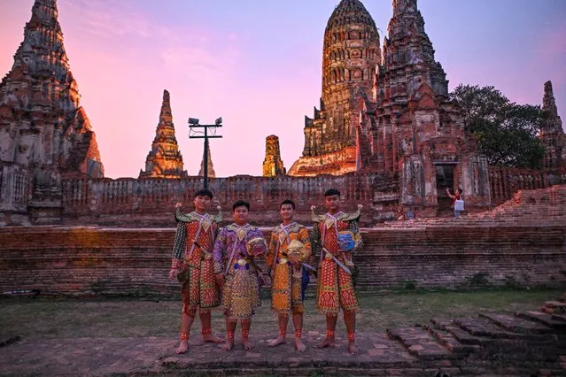 Thai artists wearing traditional costumes pose as they wait for the start of popular “Khon” theatrical dance performance showcasing the story of the epic Ramayana, at the 17th century Wat Chaiwatthanaram temple in the ancient capital of Ayutthaya, a UNESCO world heritage site north of Bangkok on March 9, 2024. (Photo by Manan Vatsyayana/AFP Photo)