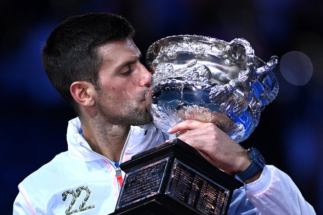 Novak Djokovic of Serbia kisses the Norman Brookes Challenge Cup after winning the men’s singles final against Stefanos Tsitsipas of Greece at the 2023 Australian Open tennis tournament in Melbourne, Australia, 29 January 2023. (Photo by James Ross/EPA/EFE)