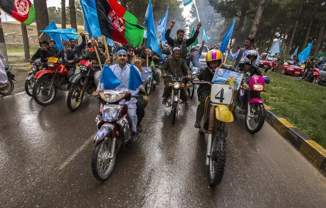 Supporters of Afghan presidential candidate Abdullah Abdullah ride their motorcycles, as they lead his convoy after his arrival to attend an election campaign in Herat province April  1, 2014. (Photo by Zohra Bensemra/Reuters)