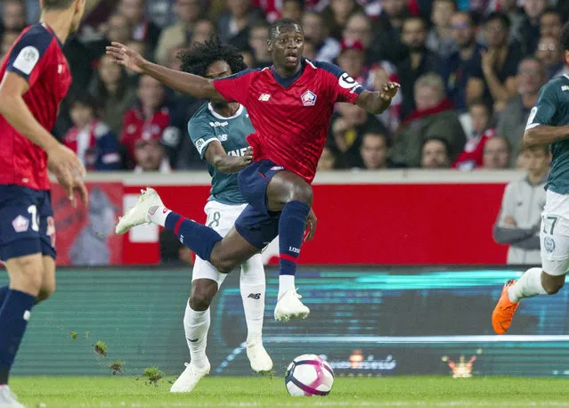 In this Saturday, September 22, 2018 file photo, Lille's Nicolas Pepe, center, in action during the French League One soccer match against Nantes at the Lille Metropole stadium, in Villeneuve d'Ascq, northern France.  Arsenal has broken its transfer record on Thursday August 1, 2019, by signing winger Nicolas Pepe from Lille as the London club tries to return to the Champions League. (Photo by Michel Spingler/AP Photo/File)