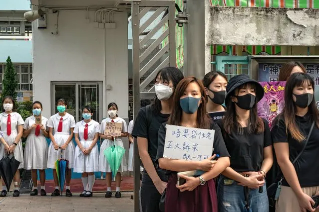 Students and alumni of Kit Sam Lam Bing Yim Secondary School stand as they form a human chain during a protest on September 5, 2019 in Hong Kong, China. Pro-democracy protesters have continued rallies on the streets since 9 June as the city plunged into crisis after waves of demonstrations and several violent clashes. Protesters have continued to draw large crowds for the five demands. (Photo by Anthony Kwan/Getty Images)