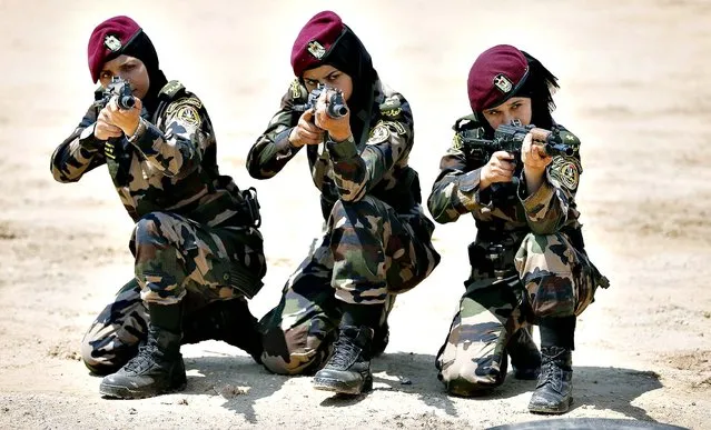 Female members of the Palestinian presidential guard take part in a training session given by French GIGN gendarme in the West Bank city of Jericho, on May 12, 2014. (Photo by Thomas Coex/AFP Photo)