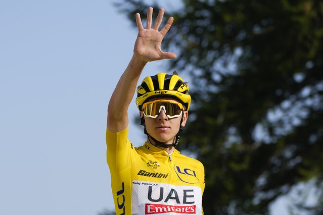 Slovenia's Tadej Pogacar, wearing the overall leader's yellow jersey, flashes five fingers for his fifth stage victory as he crosses the finish line to win the twentieth stage of the Tour de France cycling race over 132.8 kilometers (82.5 miles) with start in Nice and finish in La Couillole pass, France, Saturday, July 20, 2024. (Photo by Jerome Delay/AP Photo)