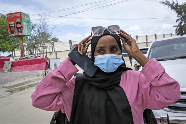 Ramlo Mohamed, one of the evacuees, describes her experience after arriving back home at the airport in Mogadishu, Somalia Sunday, April 30, 2023. 148 Somali nationals, mostly students, fleeing violence in Sudan arrived back home by plane on Sunday from the Ethiopian capital Addis Ababa, after a land trip from Sudan via Ethiopia facilitated by the Somali government. (Photo by Farah Abdi Warsameh/AP Photo)