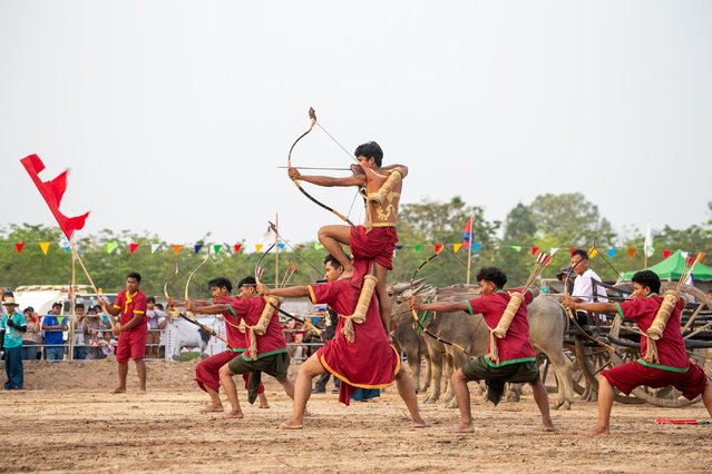 Artists perform archery during the Sankranta festival at the Angkor Archeological Park in Siem Reap province, Cambodia on April 16, 2023. Cambodia kicked off the three-day Sankranta festival, or the Khmer New Year celebration, on Friday. A variety of events, including a cultural show, traditional games, dancing, singing, martial arts, trade exhibition, food show, and modern concert, were held at the festival. (Photo by Sao Khuth/Xinhua/Alamy Live News)