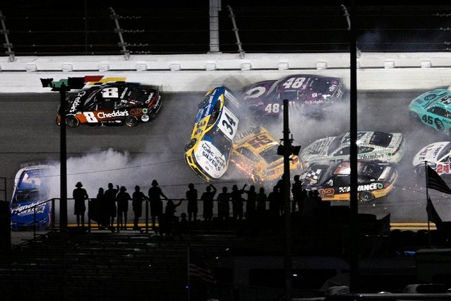Michael McDowell (34) gets airborne in a collision with Joey Logano (22) between Turns 1 and 2 during a NASCAR Cup Series auto race at Daytona International Speedway, Saturday, August 24, 2024, in Daytona Beach, Fla. (Photo by Phelan M. Ebenhack/AP Photo)
