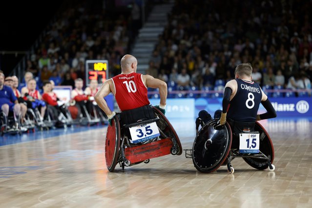 Denmark' Sebastian Frederiksen, left, makes contact with Britain' Nick Cummins during the preliminary round wheelchair rugby match between United Kingdom and Denmark, at the Paralympic Games in Paris, Friday, August 30, 2024. (Photo by Avni Trivedi/AP Photo)