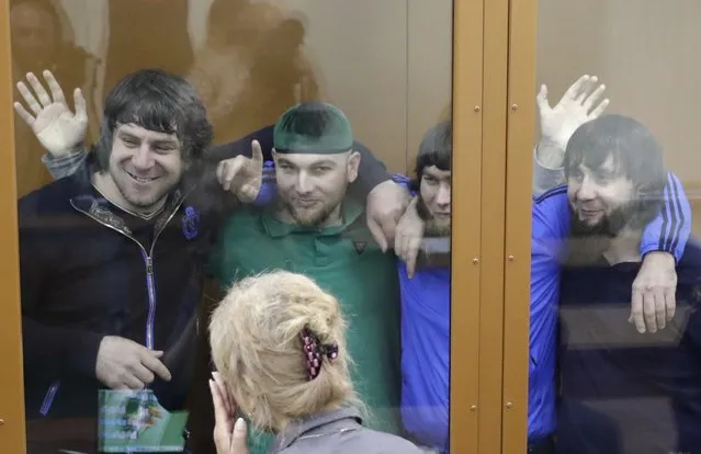 (L-R) Temirlan Eskerkhanov, Shadid Gubashev, Anzor Gubashev and Zaur Dadayev, convicted of involvement in the killing of Russian opposition leader Boris Nemtsov, react inside the defendants' cage during a hearing at the Moscow military district court, Russia July 12, 2017. (Photo by Tatyana Makeyeva/Reuters)