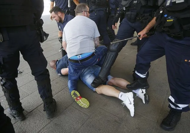 Football Soccer, EURO 2016, Marseille, France on June 21, 2016. Poland fans are detained by police at the old port of Marseille, France.     REUTERS/Wolfgang Rattay