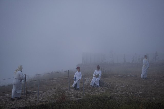 Members of the ancient Samaritan community attend the Passover pilgrimage at the religion's holiest site on the top Mt. Gerizim, near the West Bank town of Nablus, Monday, April 29, 2024. Samaritans descended from the ancient Israelite tribes of Menashe and Efraim but broke away from mainstream Judaism more then 2,800 years ago. Today, the remaining Samaritans live in the Palestinian city of Nablus in the West Bank and the Israeli seaside town of Holon, south of Tel Aviv. (Photo by Leo Correa/AP Photo)