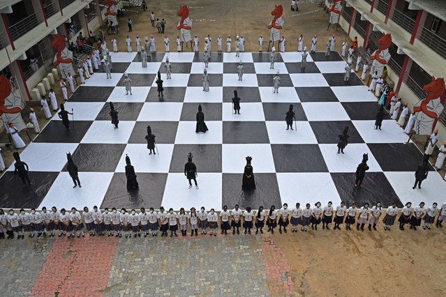 Children dressed as chess pieces perform during an event organised ahead of the 44th Chess Olympiad 2022, in Chennai on July 26, 2022. (Photo by Arun Sankar/AFP Photo)