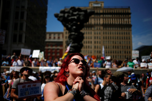 Olivia Love-Hattestad, a delegate for U.S. Senator Bernie Sanders, watches supporters speak before a protest march ahead of the 2016 Democratic National Convention in Philadelphia, Pennsylvania on July 24, 2016. (Photo by Adrees Latif/Reuters)
