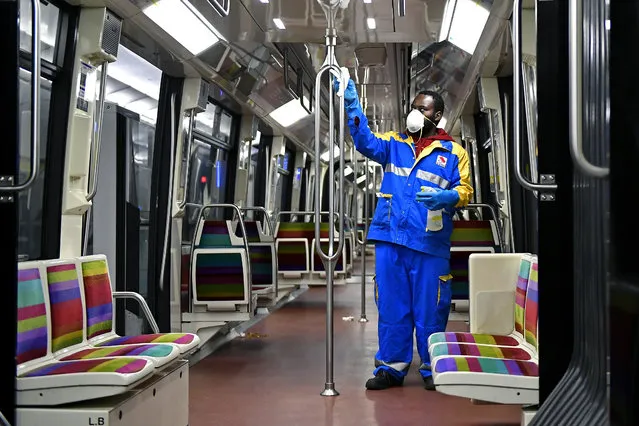A metro maintenance worker wearing a face mask is cleaning inside a metro wagon during the Coronavirus (COVID-19) pandemic on May 02, 2020 in Paris, France. The Coronavirus (COVID-19) pandemic has spread to many countries across the world, claiming over 239,000 lives and infecting over 3,35 million people. (Photo by Aurelien Meunier/Getty Images)