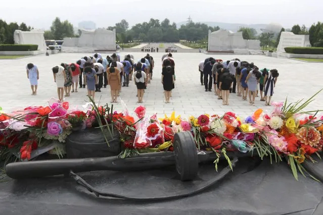 Citizens visit the Fatherland Liberation War Martyrs Cemetery in Pyongyang, North Korea, on the occasion of 69th anniversary of the end of the Korean War, which the country celebrates as the day of “victory in the fatherland liberation war”, Thursday, July 21, 2022. (Photo by Cha Song Ho/AP Photo)