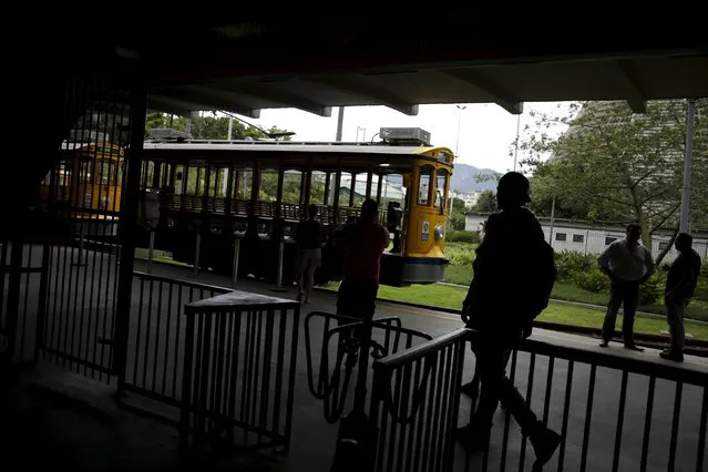 People enter a station to board the bonde, the typical tram line in Santa Teresa neighborhood in Rio de Janeiro, Brazil, September 9, 2015. (Photo by Pilar Olivares/Reuters)