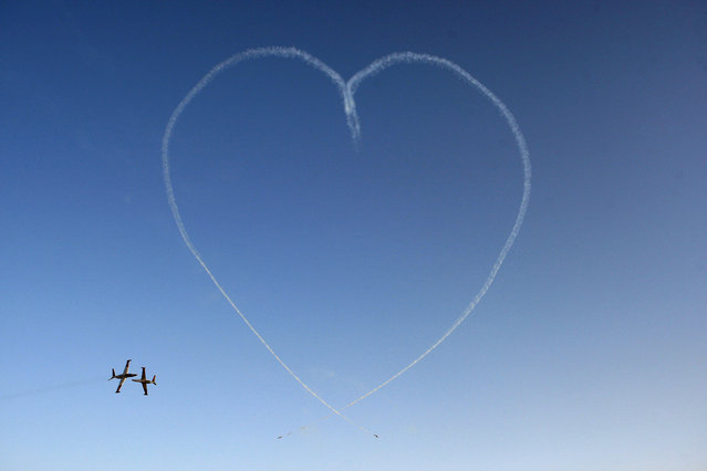 The IAF Aerobatic Team flying IAI Tzukit jet aircraft create a “heart” during a ceremony for graduating Israeli Air Force pilots at Hatzerim Air Base, June 28, 2010. (Photo by Baz Ratner/Reuters)