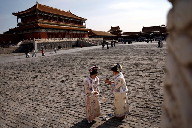 Women dressed up in Chinese traditional costumes visit the Forbidden City in Beijing, China on February 21, 2025. (Photo by Tingshu Wang/Reuters)