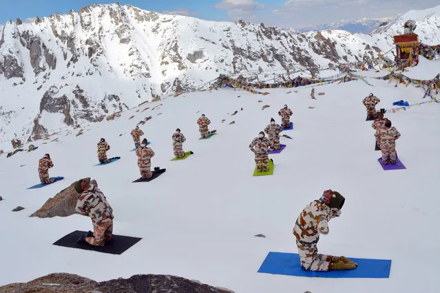 A handout photo made available by the Indo-Tibetan Border Police (ITBP) shows ITBP Force personnel performing Yoga in sub-zero temperatures, on the occasion of the International Day of Yoga, dubbed World Yoga Day, in Ladakh, India, 21 June 2020. The United Nations proclaimed 21 June as the International Day of Yoga, by its resolution 69/131 on 11 December 2014. (Photo by Indo Tibetan border police/EPA/EFE)