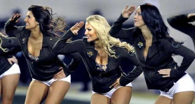 Jacksonville Jaguars cheerleaders, wearing camouflage outfits, perform during the Jaguars' game against Indianapolis. (Photo by Stephen Morton/Associated Press)
