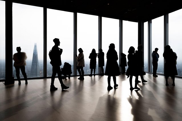 People take in the sights of the capital including The Shard from the 50th floor of 8 Bishopsgate in London on February 21, 2025. Opened in August 2023, this public viewing gallery, known as The Lookout, competes with Horizon 22, another viewing platform open to the public at 22 Bishopsgate. (Photo by Stephen Chung/Alamy Live News)