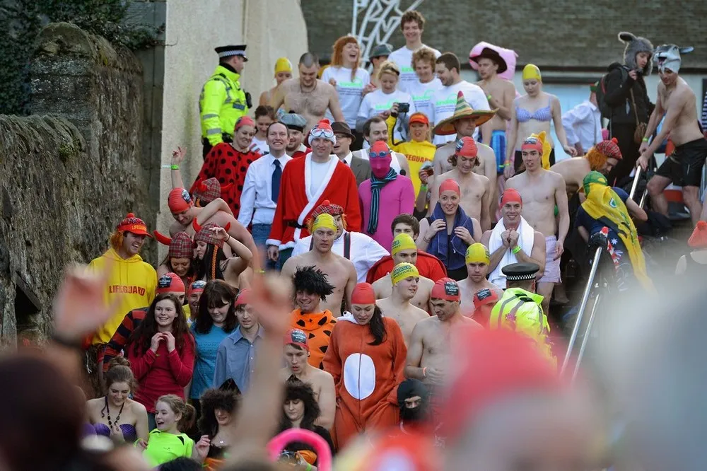 Swimmers Brave the Loony Dook New Years Day Swim by Forth Bridge