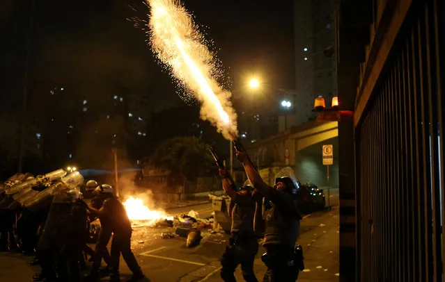 Riot police fire rubber bullets during a protest by supporters of Dilma Rousseff in Sao Paulo, Brazil August 31, 2016. (Photo by Paulo Whitaker/Reuters)