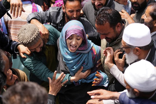 A relative wails during the funeral procession of Adil Hussain Shah, a daily-wage worker, who died when militants indiscriminately opened fire on a crowd of mainly tourists on Tuesday, at his village Hapatnar, about 20 km (13 miles) from Pahalgam where the incident took place, Indian controlled Kashmir, Wednesday, April 23, 2025. (Photo by Dar Yasin/AP Photo)