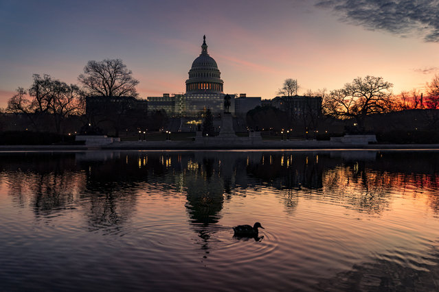 The Capitol is seen in Washington, early Wednesday, December 14, 2022. Lawmakers leading the negotiations on a bill to fund the federal government for the current fiscal year say they've reached agreement on a “framework” that should allow them to complete work on the bill over the next week and avoid a government shutdown. (Photo by J. Scott Applewhite/AP Photo)