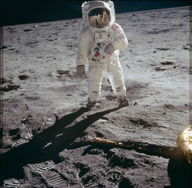Astronaut Edwin E. Aldrin Jr., lunar module pilot, walks on the surface of the moon near the leg of the Lunar Module (LM) "Eagle" during the Apollo 11 extravehicular activity (EVA) in this July 20, 1969 NASA handout photo. (Photo by Reuters/NASA)