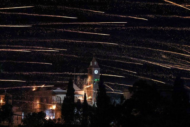 Handmade rockets fly over Panagia Erithiani church during Greek Orthodox Easter celebrations in the village of Vrontados, on the island of Chios, Greece, on April 19, 2025. (Photo by Konstantinos Anagnostou/Reuters)