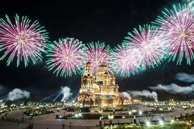 Fireworks explode over the Cathedral of Russian Armed Forces during the Spasskaya Tower military music festival in Kubinka, outside Moscow, Russia, Sunday, September 6, 2020. Due to coronavirus, the annual international music festival in Red Square was canceled, an online festival without spectators took place Sunday on the Cathedral Square in Patriot Park, outside Moscow. (Photo by Pavel Golovkin/AP Photo)