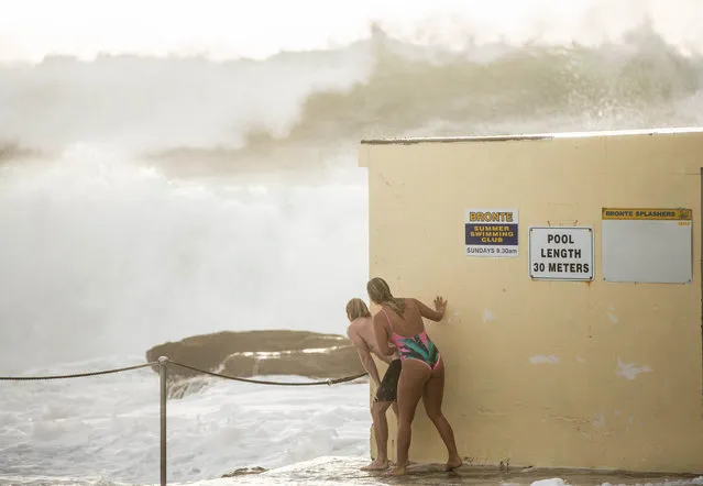 Jack Destine and Ella Dove brave the stormy conditions at the Bronte beach ocean pool in the eastern suburbs of Sydney, Australia on January 15, 2018. (Photo by Glenn Campbell/AAP)