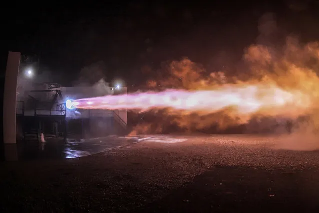 This September 25, 2016 photo made available by SpaceX shows a test firing of the company's Raptor engine in McGregor, Texas. On Tuesday, September 27, 2016, SpaceX founder Elon Musk announced his company's plan for travel to the planet Mars. The engine is being tested for use in the new spacecraft. (Photo by SpaceX via AP Photo)