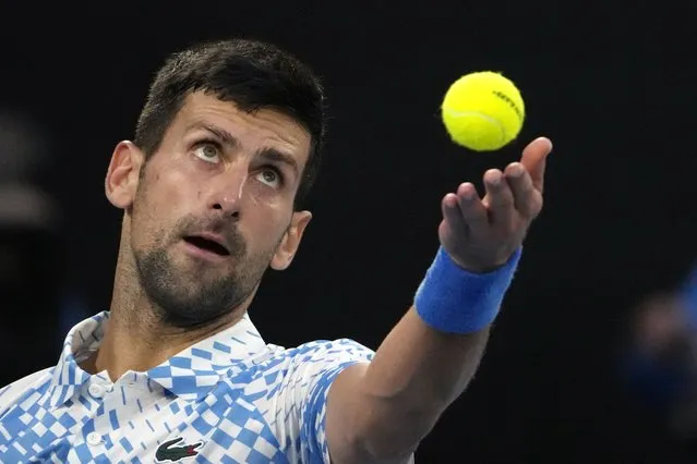 Novak Djokovic of Serbia serves to Andrey Rublev of Russia during their quarterfinal match at the Australian Open tennis championship in Melbourne, Australia, Wednesday, January 25, 2023. (Photo by Ng Han Guan/AP Photo)