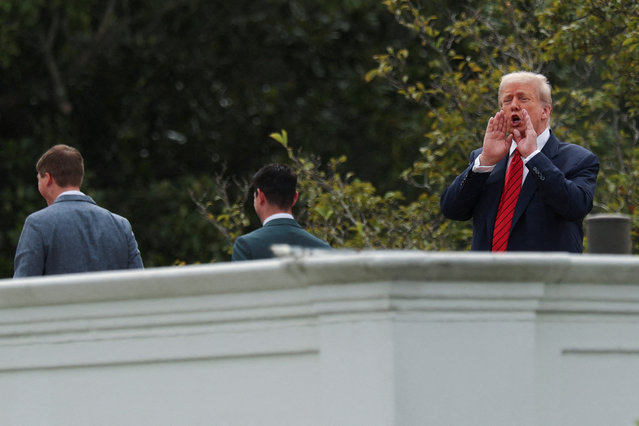 U.S. President Donald Trump jokes to reporters that he's planning to install nuclear missiles, while on a walk with an architect and aides on the roof of the White House on August 5, 2025. (Photo by Jonathan Ernst/Reuters)