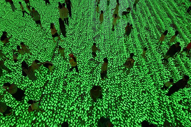 People visit the China Film museum in Beijing on August 1, 2025. (Photo by Adek Berry/AFP Photo)