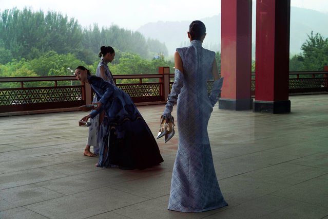 Models prepare for the Misuity SS2026 China Fashion Week opening show held on the outskirts of Beijing, China, Friday, September 5, 2025. (Photo by Ng Han Guan/AP Photo)