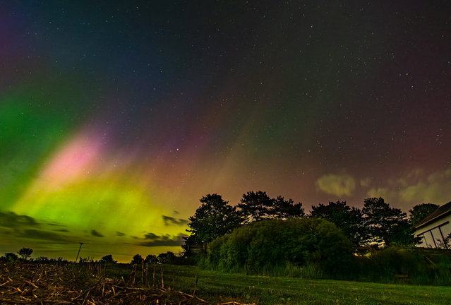 The Northen Lights, or aurora borealis, illuminate the sky in Alaiedon Township, Michigan, U.SS. on May 10, 2024. (Photo by Matthew Dae Smith/Lansing State Journal/USA Today Network via Reuters)