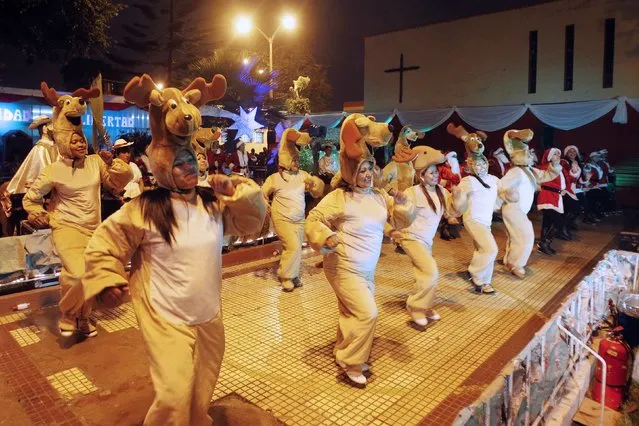 Inmates dressed as reindeers perform during an event ahead of Christmas celebrations at Santa Monica female prison in Lima December 19, 2014. (Photo by Enrique Castro-Mendivil/Reuters)