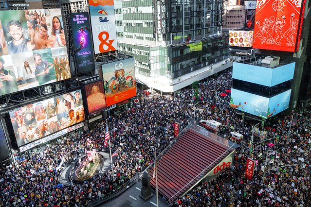 Thousands of protesters fill Times Square during a "No Kings" protest in New York, October 18, 2025. (Photo by Olga Fedorova/AP Photo)