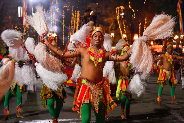 Sri Lankan traditional dancers perform during the annual Esala Perahera Buddhist cultural pageant at the Temple of the Tooth Relic in Kandy, Sri Lanka, on August 4, 2025. (Photo by Krishan Kariyawasam/NurPhoto/Rex Features/Shutterstock)