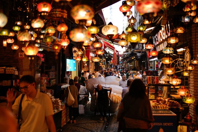 A porter pulls a trolley loaded with goods in the popular Eminonu commercial area of Istanbul, Turkey, Wednesday, September 24, 2025. (Photo by Emrah Gurel/AP Photo)