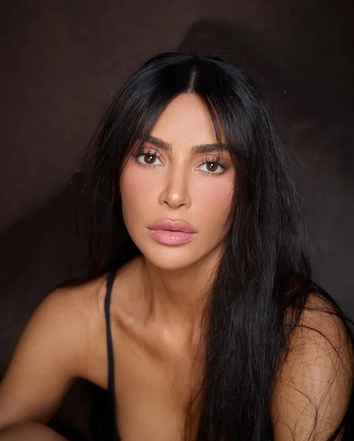 American socialite and media personality Kim Kardashian has debuted a fresh set of bangs on Instagram on Sunday, April 23, 2023. The beauty mogul stared down the camera in multiple “natural” looks, pairing her new 'do with tiny shorts and a crop top. (Photo by Kim Kardashian/Instagram/PierreSnaps)