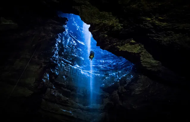 A member of the public is winched in to Gaping Gill, the largest cavern in Britain, situated in Yorkshire Dales National Park as it opens to the public this weekend, May 26, 2018. (Photo by Danny Lawson/PA Images via Getty Images)